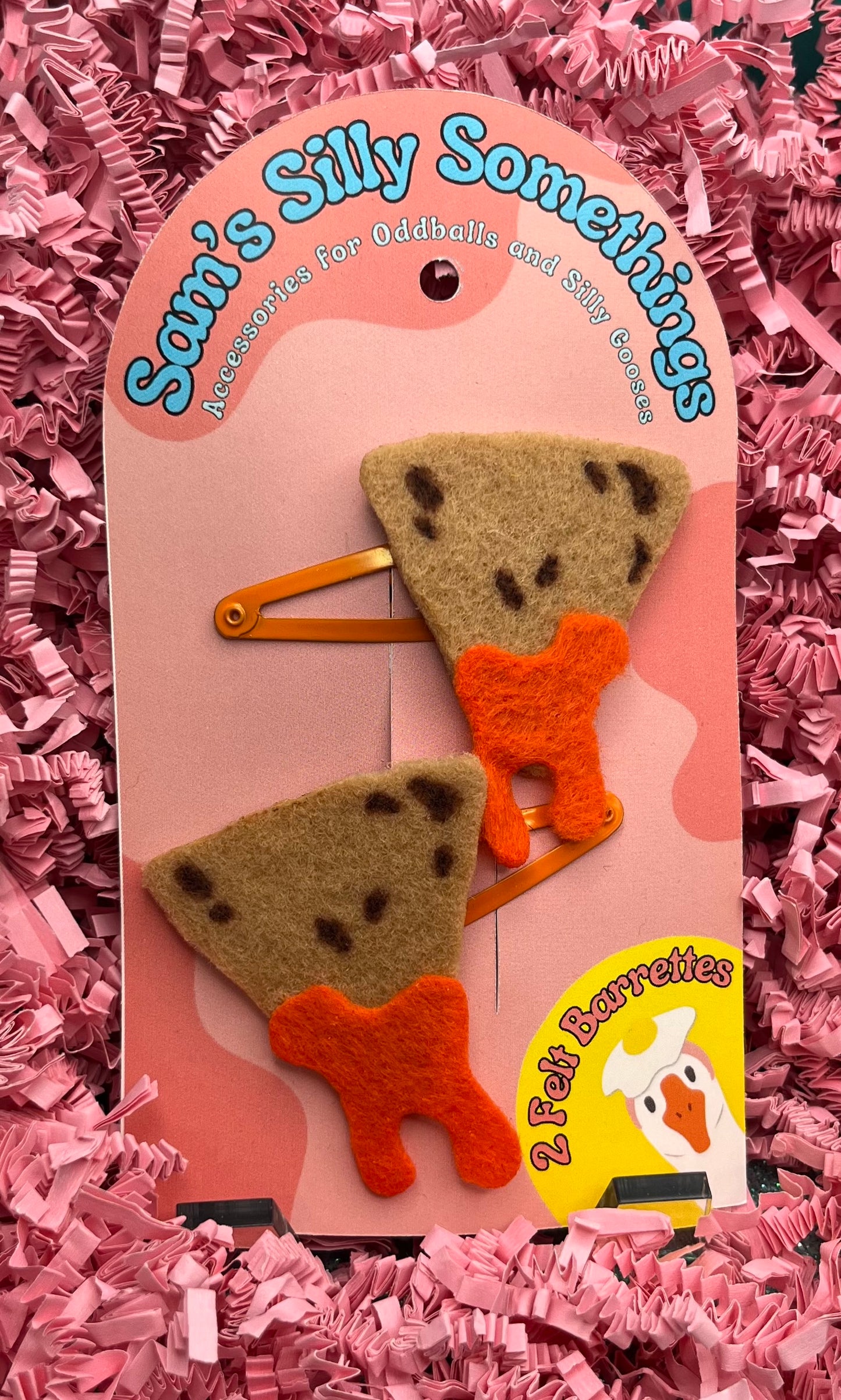 Two felt hair clips shaped like nachos on a pink card with 'Sam's Silly Somethings' branding.