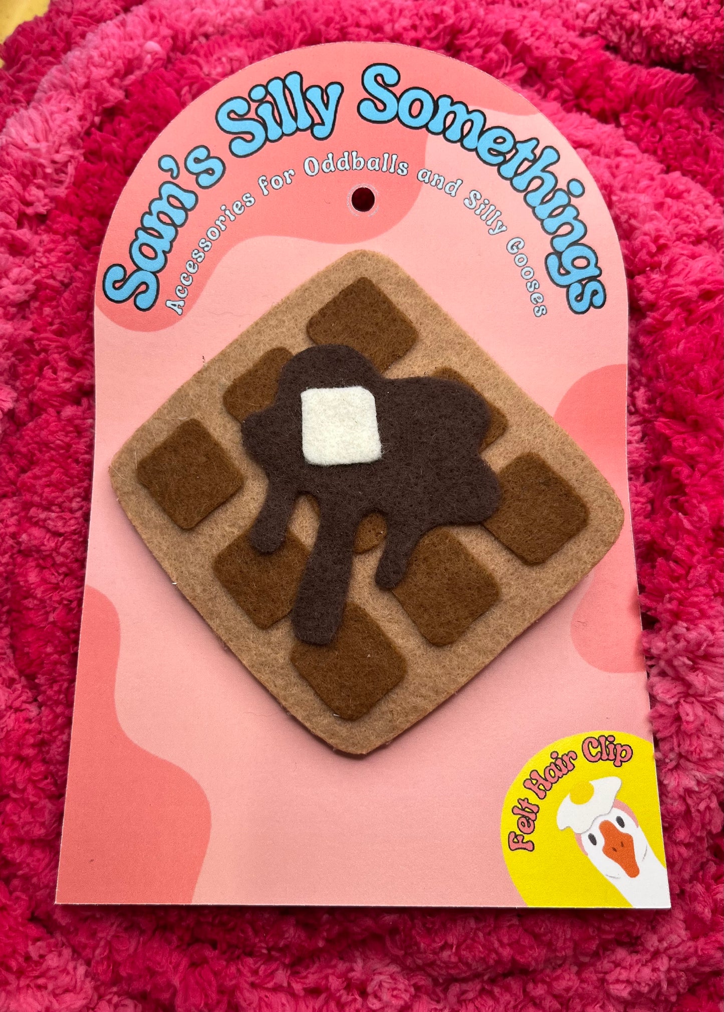 Hair clip with a waffle design on a pink packaging with 'Sami's Silly Somethings' branding.